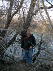 The blogger standing on the bank of the San Juan River in Farmington, NM.