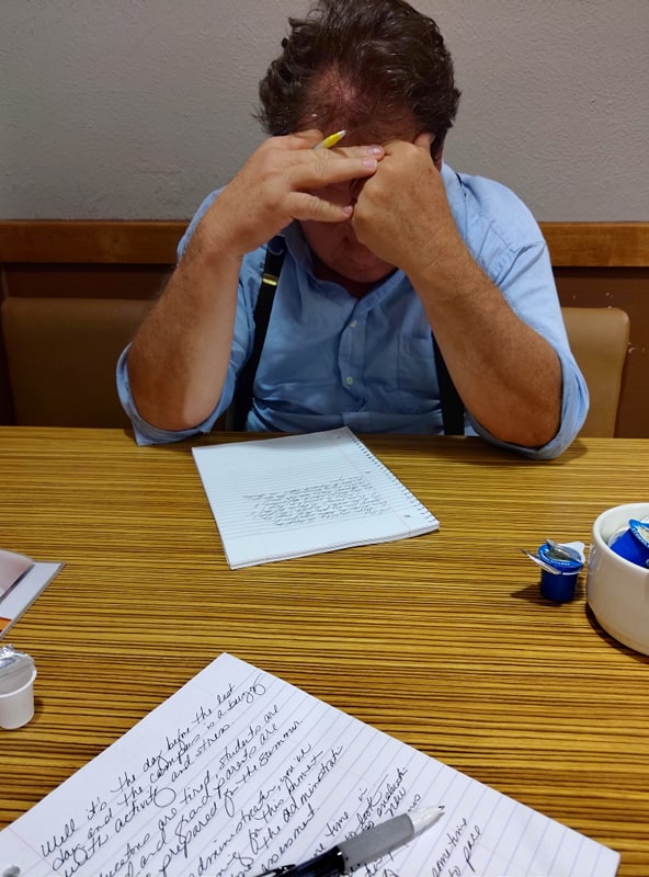 Writing at IHOP, 2019. Photo by Fran.